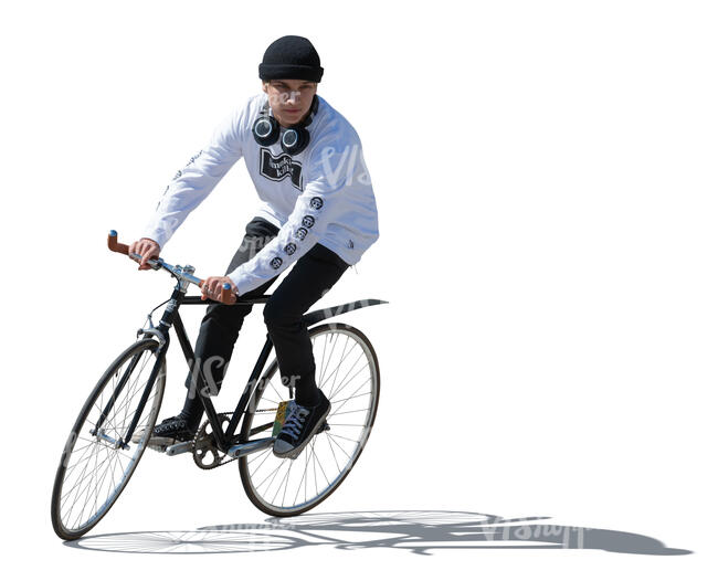 cut out young sidelit man riding a bike