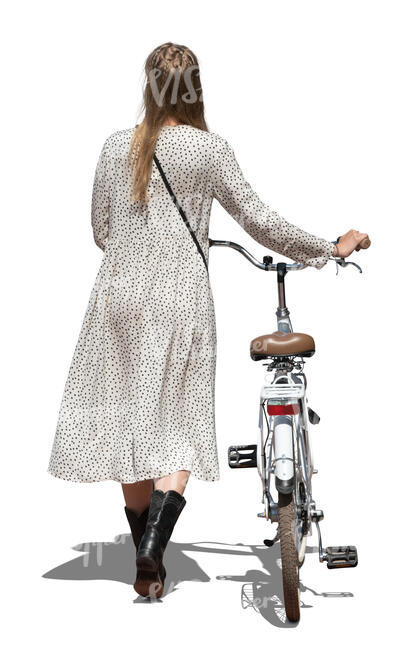 cut out woman in a long summer dress walking and pushing a bike