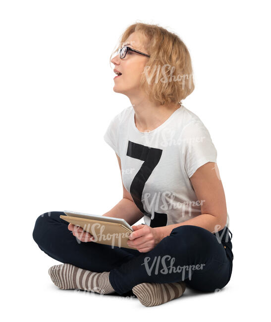 cut out woman with a tablet sitting on the floor and looking up