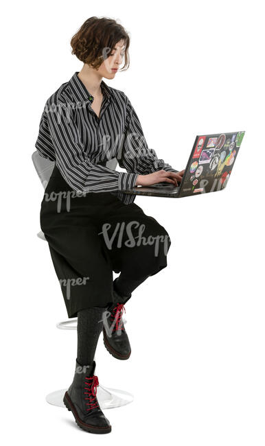 cut out young woman working with laptop sitting at a bar counter