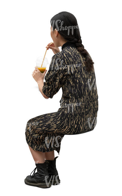 cut out woman sitting in a cafe and drinking juice