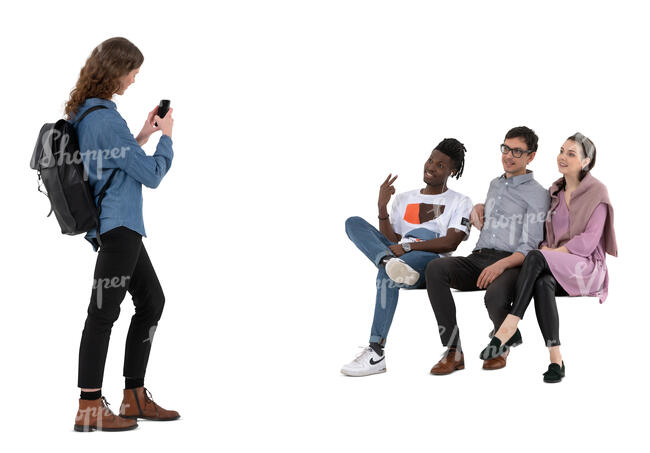 cut out young woman taking a picture of her three friend sitting on a bench