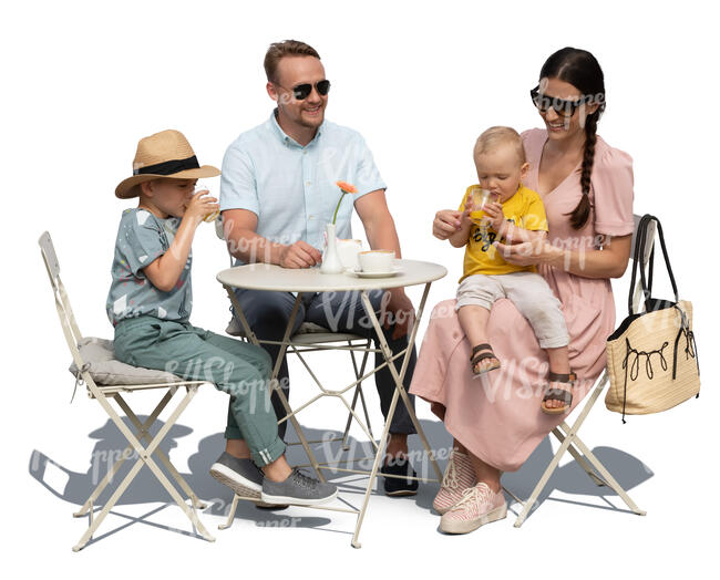family with two kids sitting in a cafe on a summer day