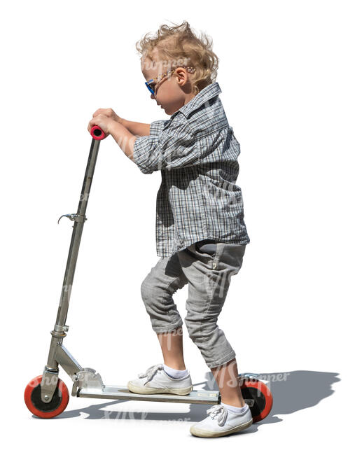 little boy riding a scooter