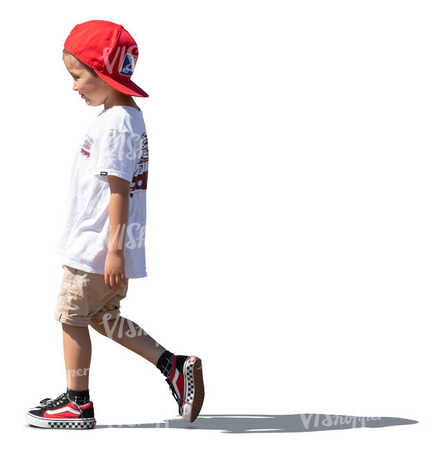 boy with a red hat walking