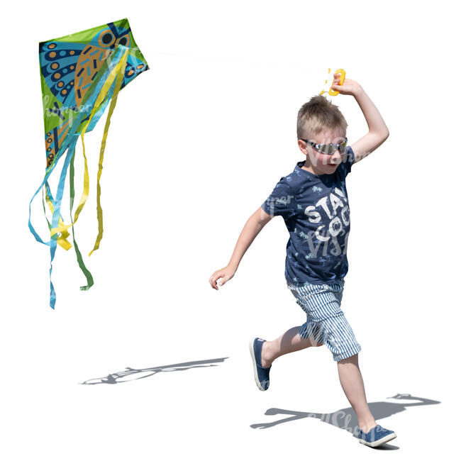 little boy flying a kite