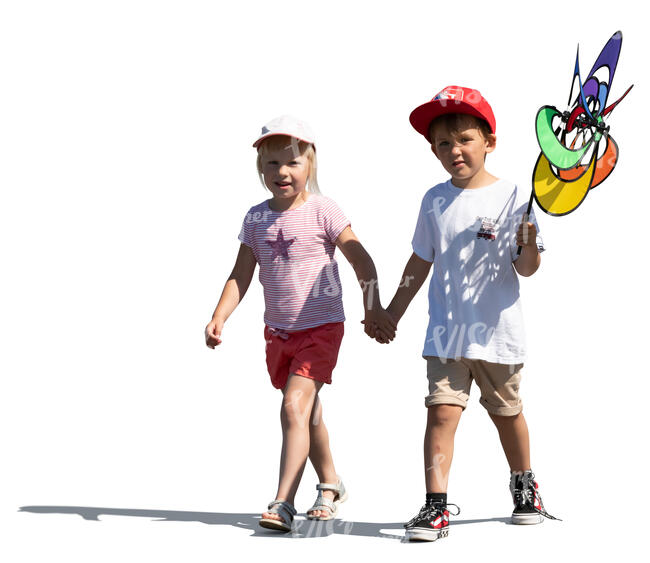 two kids walking hand in hand