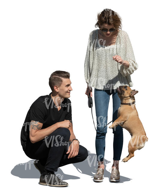 cut out man and woman playing with a dog