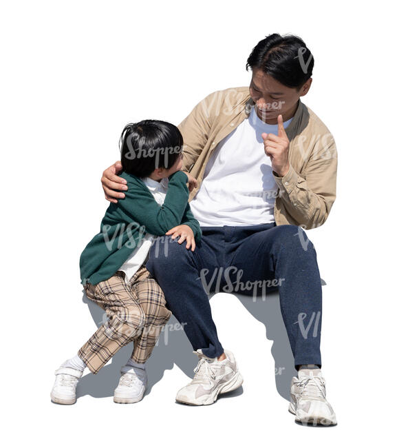 cut out asian father and son sitting and talking