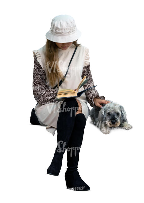 cut out woman with a dog sitting and reading a book