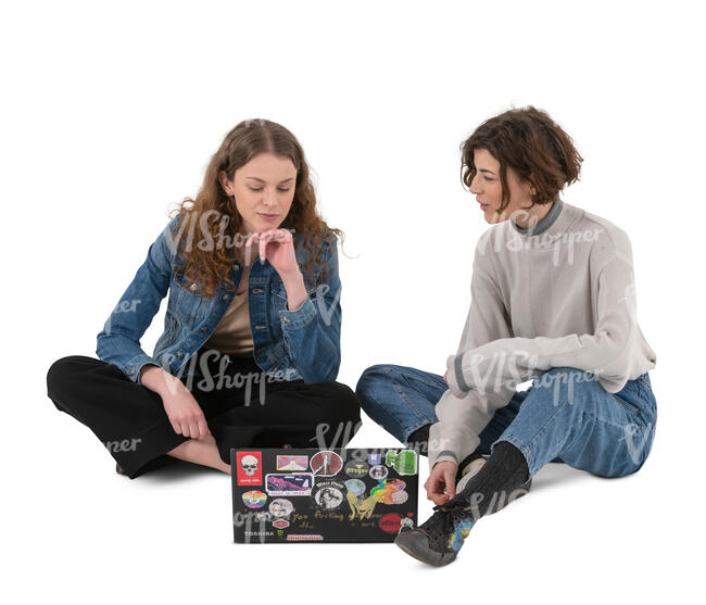 two cut out young women sitting on the ground and talking