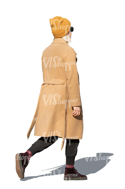 cut out woman in a brown overcoat walking