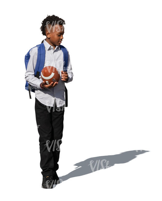 cut out black kid with a football ball walking