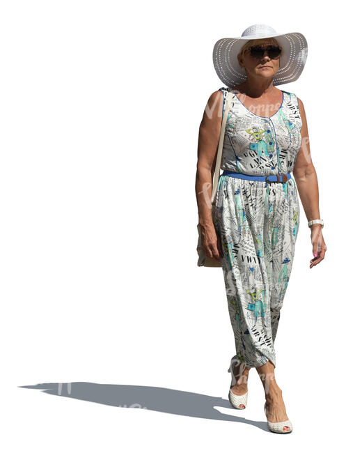 cut out older woman in a summer dress walking