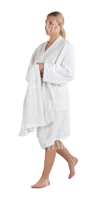 cut out woman in a white bathrobe walking