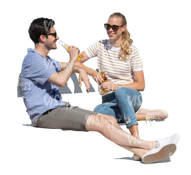 cut out joyful man and woman sitting outside and drinking