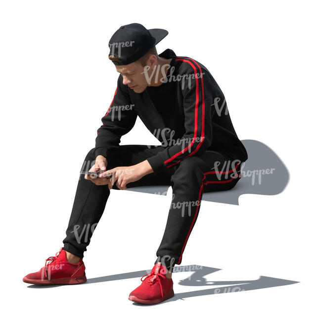 cut out young man sitting and browsing his phone