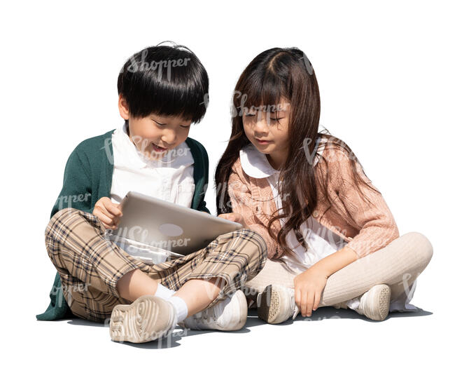 two cut out asian kids sitting and watching their ipad