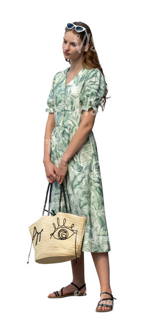 cut out woman in a green summer dress standing