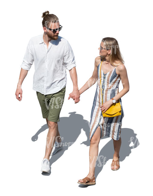 top view of a man and woman walking hand in hand