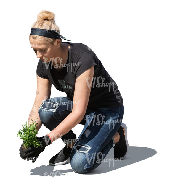 cut out woman planting flowers in the garden