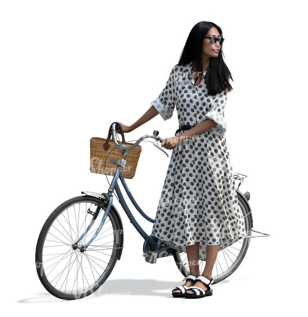 cut out asian woman in a summer dress standing and holding a bicycle