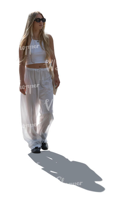 cut out backlit woman in white summer trousers walking