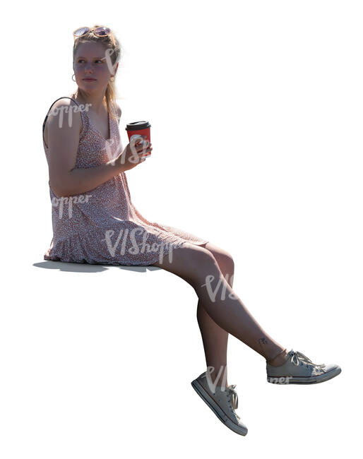 cut out woman sitting on the balustrade and drinking coffee