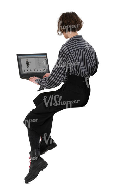 cut out woman sitting on a counter height table with a laptop