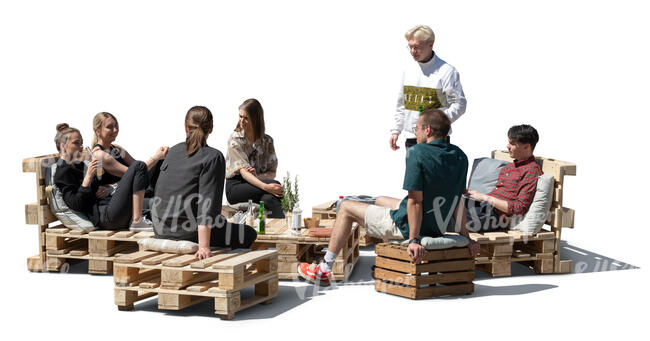 cut out group of young people relaxing in an outdoor cafe