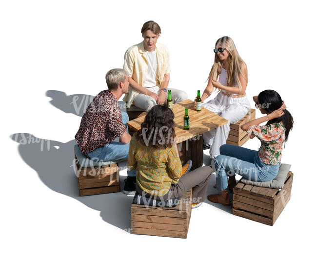 cut out group of young people sitting in an improvised cafe and drinkig beer