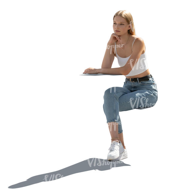 cut out backlit woman sitting and leaning on a table