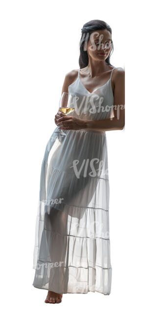 cut out backlit woman in a white dress leaning against the door and drinking wine