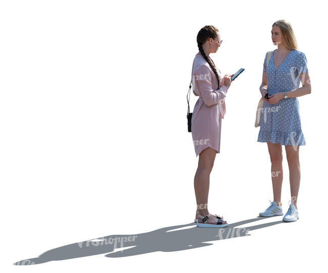 two cut out backlit women standing and talking