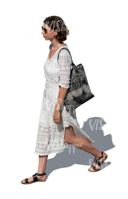 cut out woman in a white dress walking seen from above