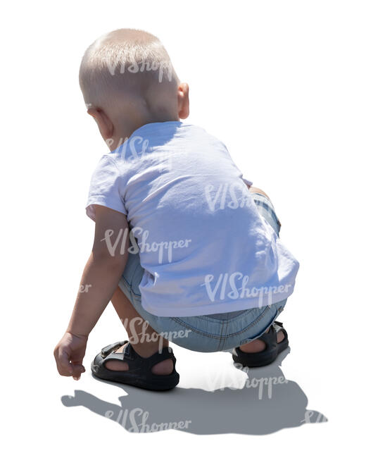 cut out little backlit boy squatting and playing