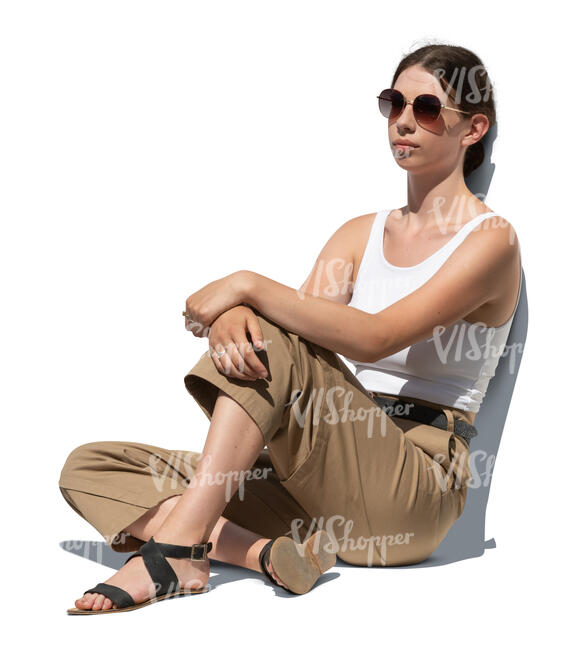 cut out young woman sitting on the ground