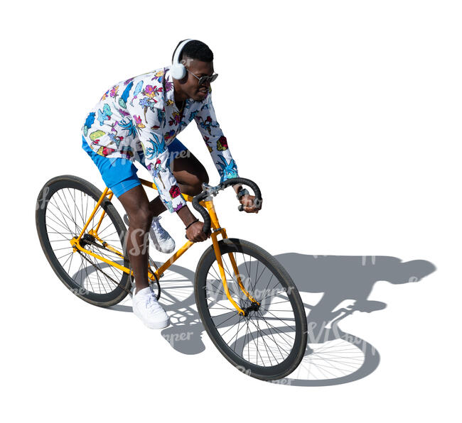 cut out black man with headphones riding a bike seen from above