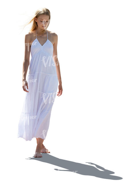 cut out backlit woman in a white dress walking barefoot