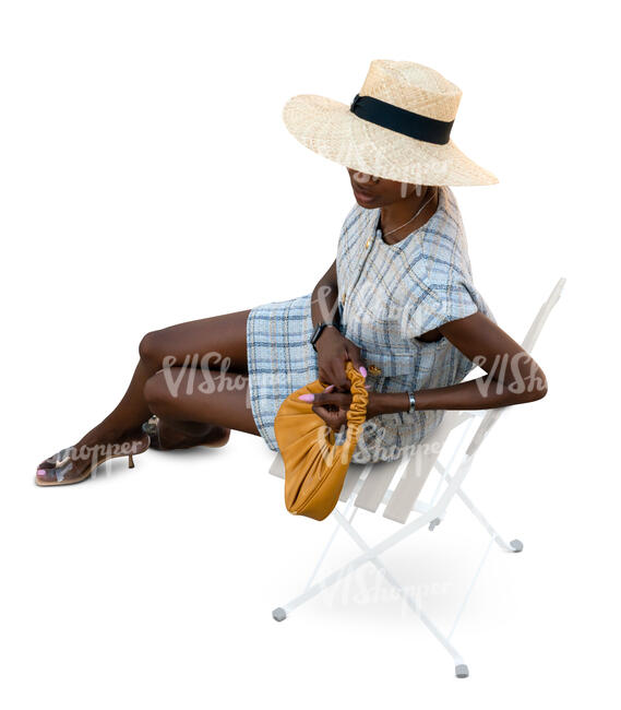 cut out chic woman with a hat sitting seen from above