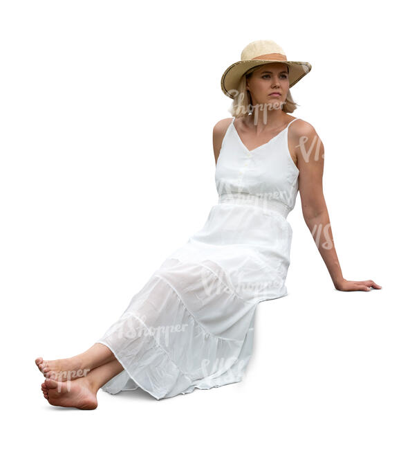 cut out woman in a white dress sitting on a terrace