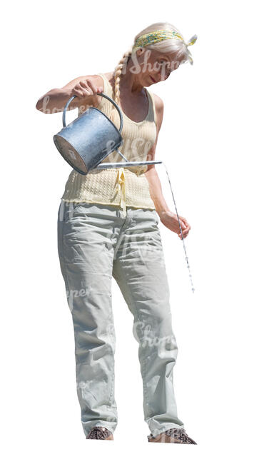 cut out elderly woman standing on a balcony and watering plants