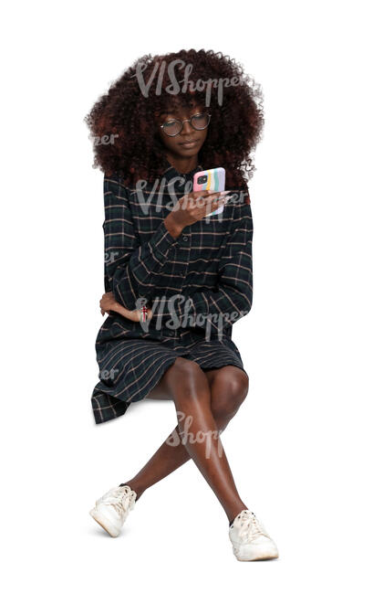 cut out woman sitting and checking her phone