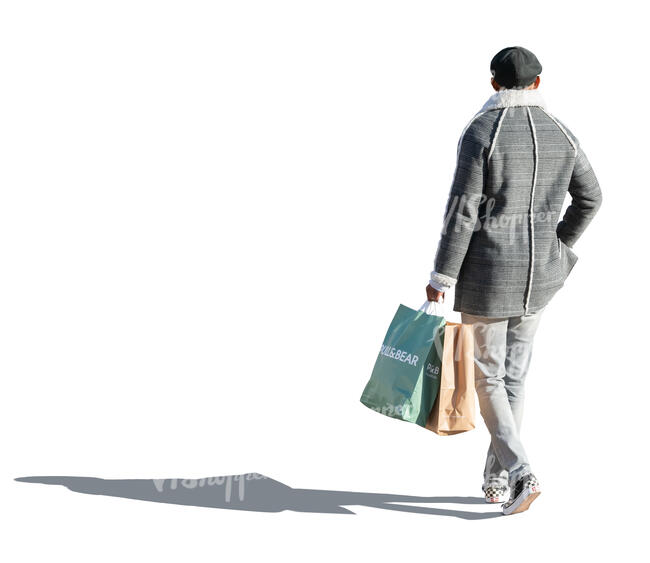 cut out man in a grey overcoat and carrying shopping bags walking 