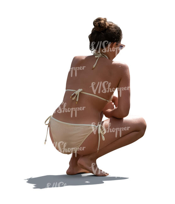 cut out backlit woman in bikini squatting