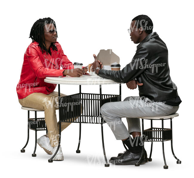 two cut out women sitting in a cafe and eating lunch