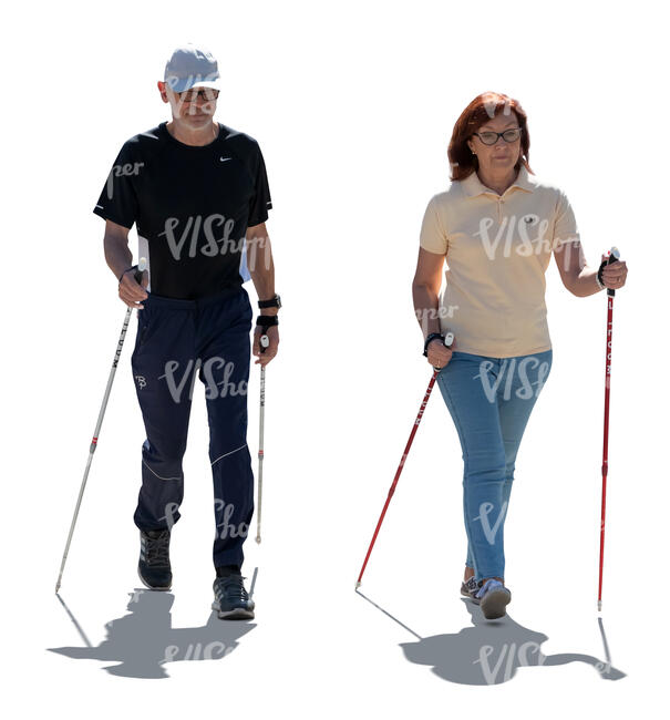 cut out backlit elderly couple nordic walking