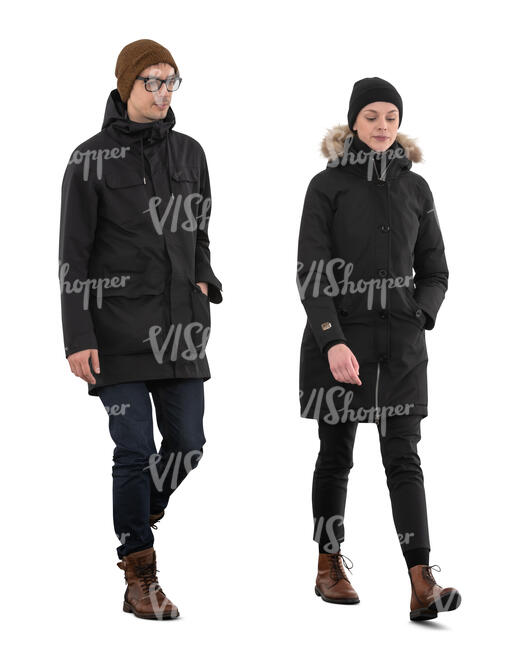 two cut out people on winter overcoats walking