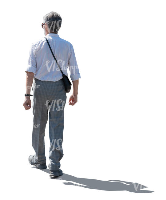cut out backlit elderly man walking