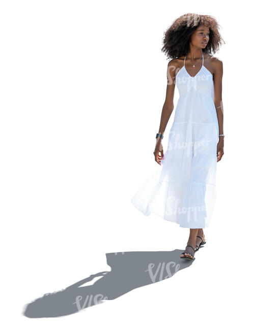 cut out backlit woman in a white summer dress walking